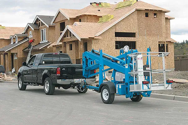 Dade compact hydraulic crawler spider boom lift at a residential housing construction site