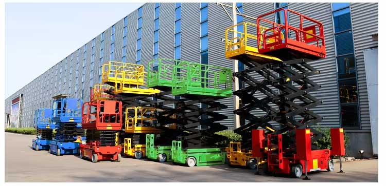 Red electric scissor lift operating in high-density warehouse racking system