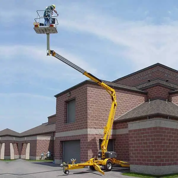 Yellow towable boom lift used for residential roof maintenance