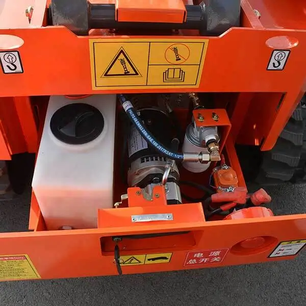 Hydraulic oil tank fluid reservoir setup inside tracked lift engine bay compartment