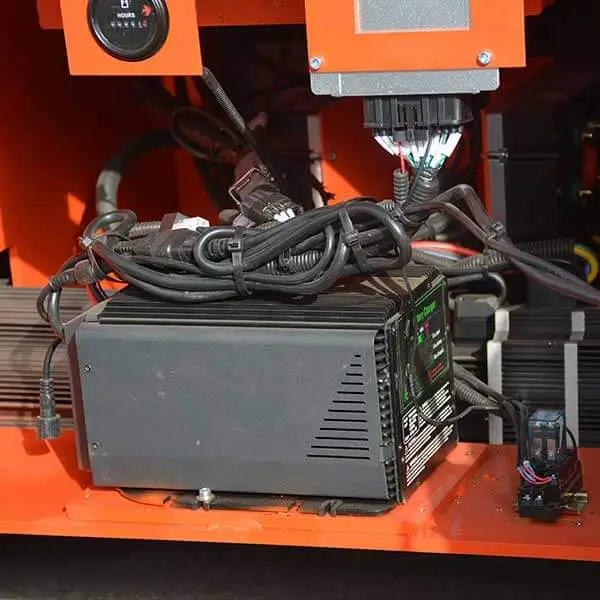 Intelligent digital electronic controller module block inside crawler lift chassis compartment