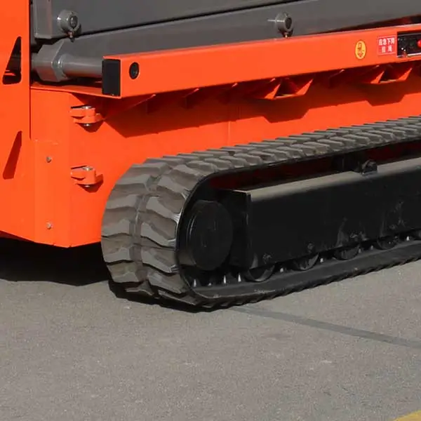 Durable rubber crawler track undercarriage on rough-terrain scissor lift chassis