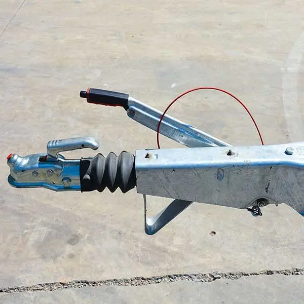 Heavy-duty towing hitch and safety cable on trailer boom lift